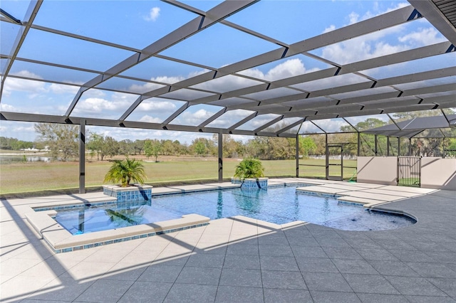 pool featuring a lanai, a patio area, and a lawn