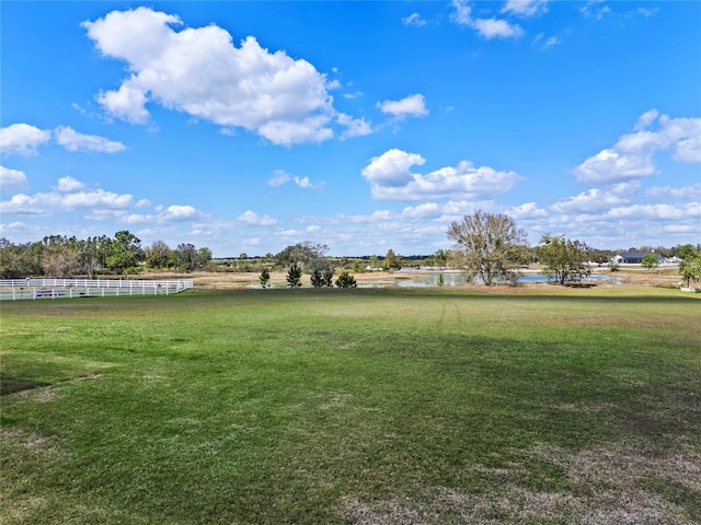 view of yard with a rural view