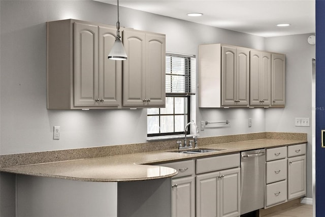 kitchen with dishwasher, hanging light fixtures, and a sink