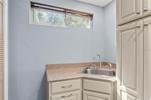 kitchen with light countertops and a sink