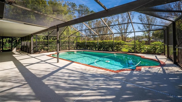 outdoor pool with a lanai and a patio