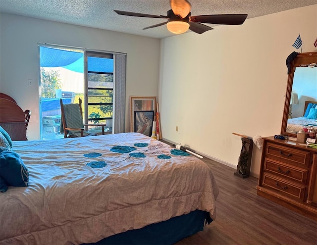 bedroom featuring a ceiling fan, a textured ceiling, wood finished floors, access to outside, and baseboards