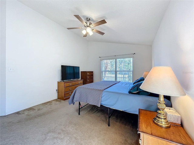 bedroom with carpet floors, ceiling fan, and vaulted ceiling