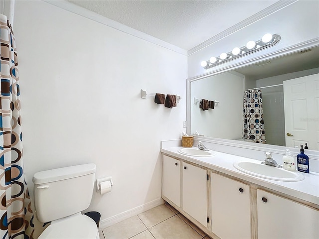 full bath with a sink, toilet, tile patterned floors, and crown molding