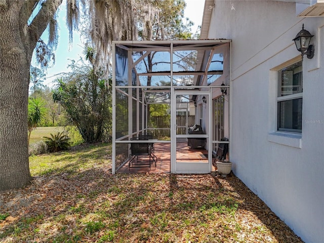 view of yard with glass enclosure