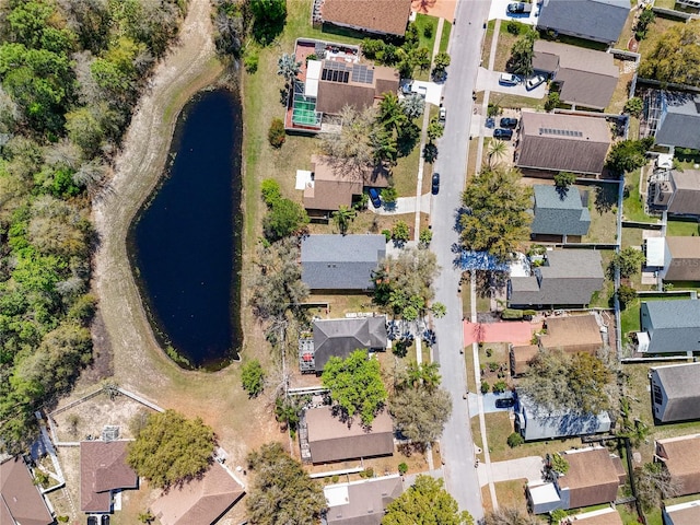 bird's eye view featuring a residential view and a water view