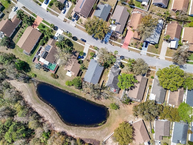 drone / aerial view with a water view and a residential view