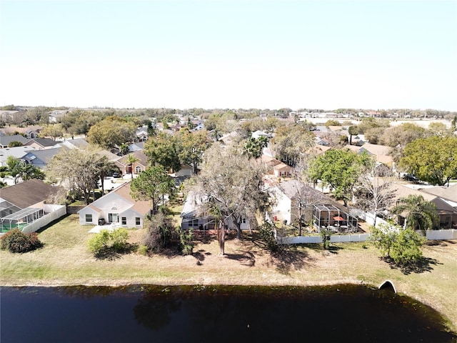 birds eye view of property with a residential view and a water view