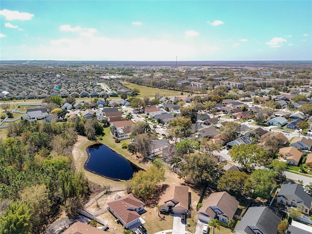 bird's eye view with a residential view and a water view