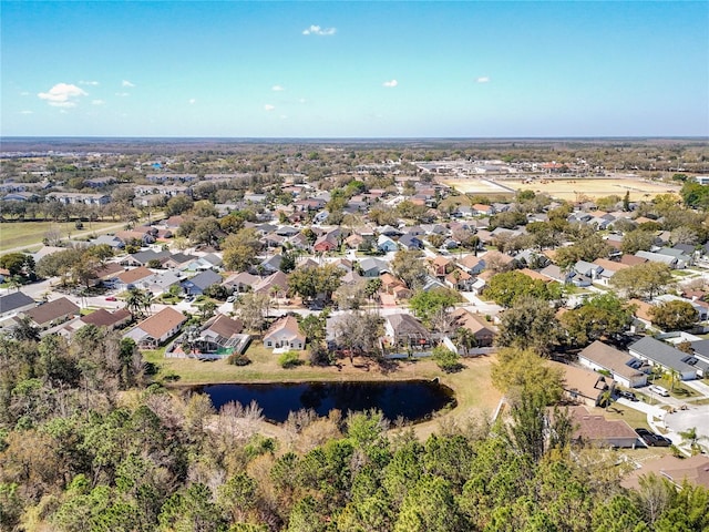 drone / aerial view with a residential view and a water view