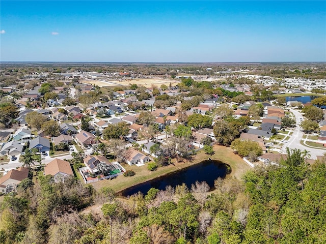 birds eye view of property featuring a residential view and a water view