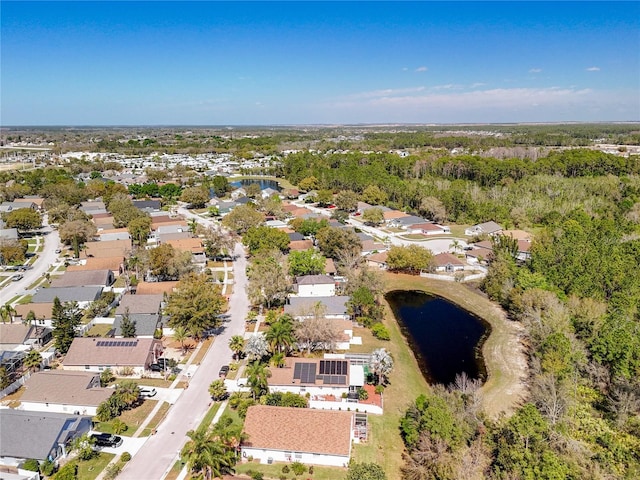 birds eye view of property featuring a water view and a residential view