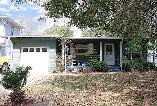 view of front of home featuring a garage and concrete driveway