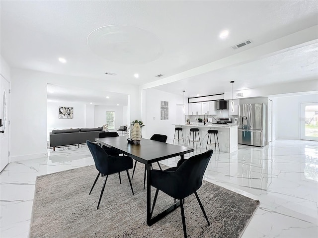 dining space with marble finish floor, baseboards, visible vents, and recessed lighting