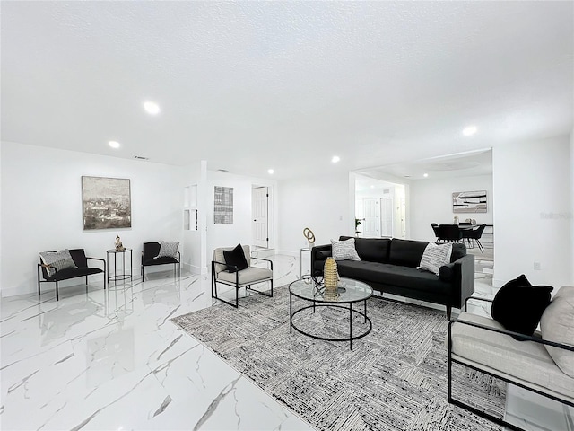 living room featuring recessed lighting, marble finish floor, a textured ceiling, and baseboards