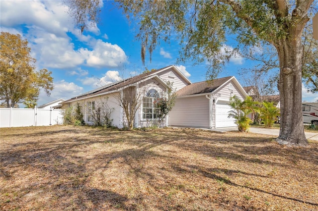 102 Ethan Ave, Davenport, FL 33897 - view of front facade with a garage