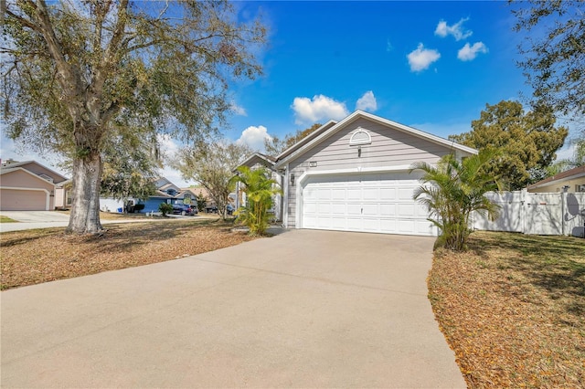 102 Ethan Ave, Davenport, FL 33897 - view of front of home with driveway and a garage