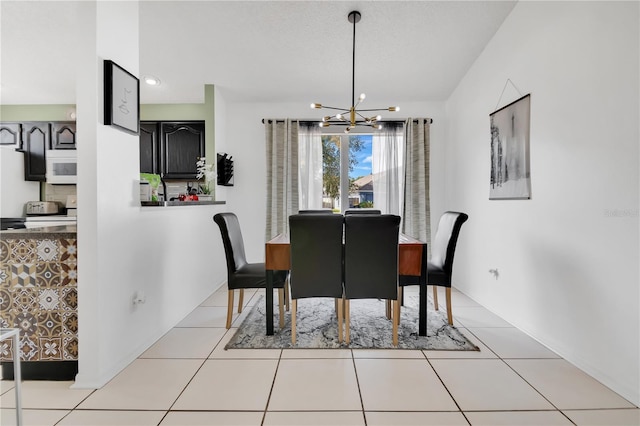102 Ethan Ave, Davenport, FL 33897 - dining area with a chandelier and tile patterned floors