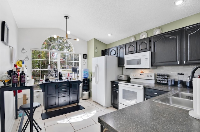 102 Ethan Ave, Davenport, FL 33897 - kitchen with white appliances, dark countertops, lofted ceiling, backsplash, and light tile patterned flooring