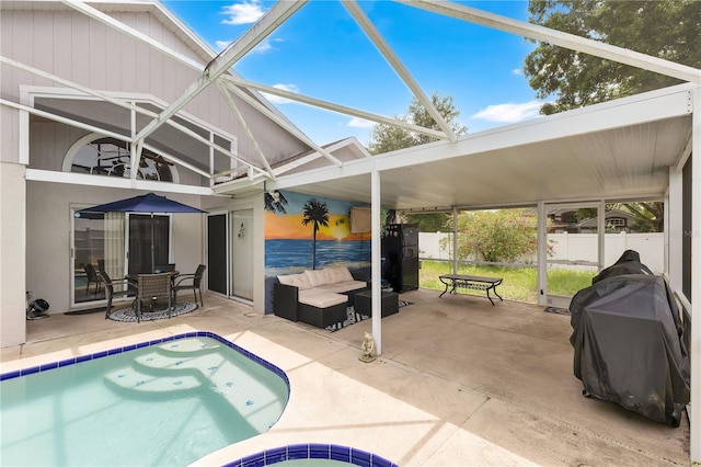 102 Ethan Ave, Davenport, FL 33897 - outdoor pool featuring a patio, glass enclosure, an outdoor living space, and grilling area
