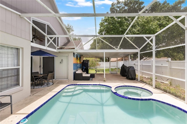 102 Ethan Ave, Davenport, FL 33897 - view of swimming pool featuring a patio, a pool with connected hot tub, grilling area, and glass enclosure