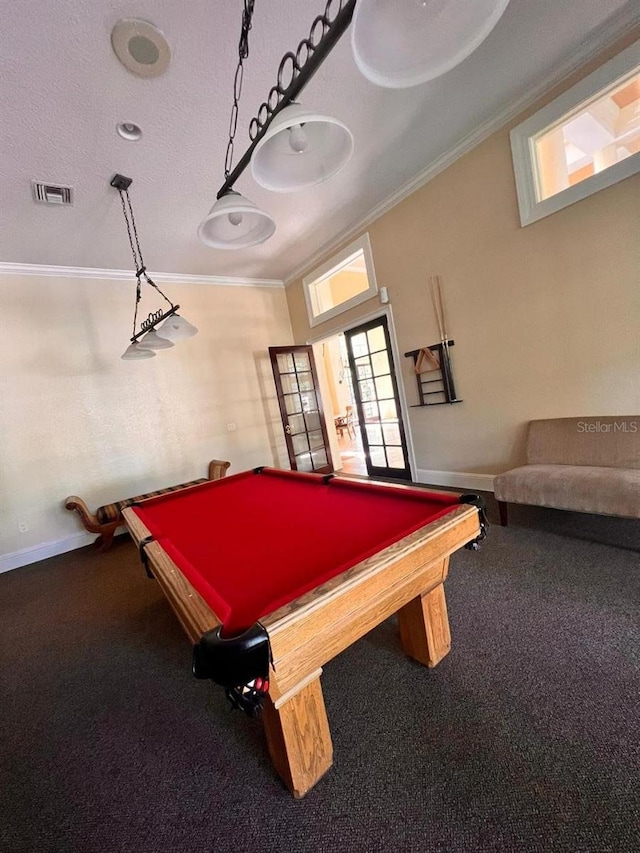 recreation room with carpet floors, ornamental molding, visible vents, and baseboards