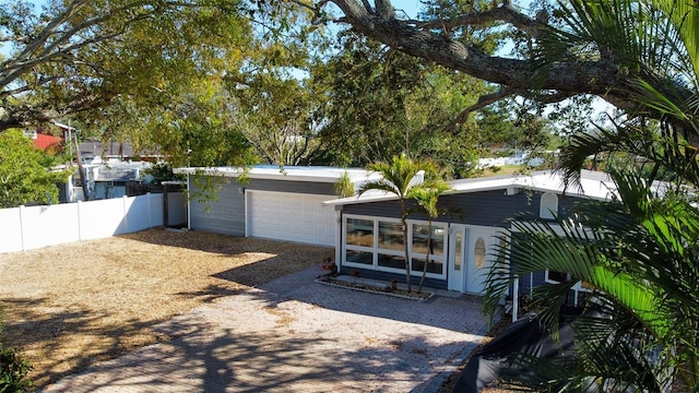 view of front of property featuring fence