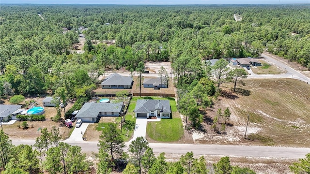 aerial view featuring a wooded view