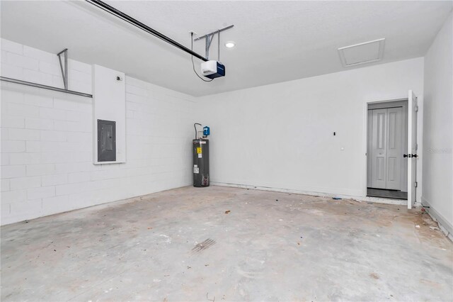garage with electric panel, a garage door opener, and electric water heater