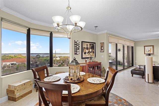 dining area featuring light tile patterned floors, a textured ceiling, a chandelier, and crown molding