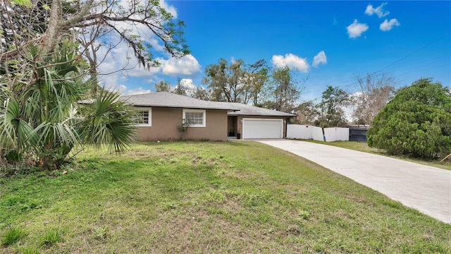 ranch-style home featuring a garage, fence, driveway, stucco siding, and a front yard