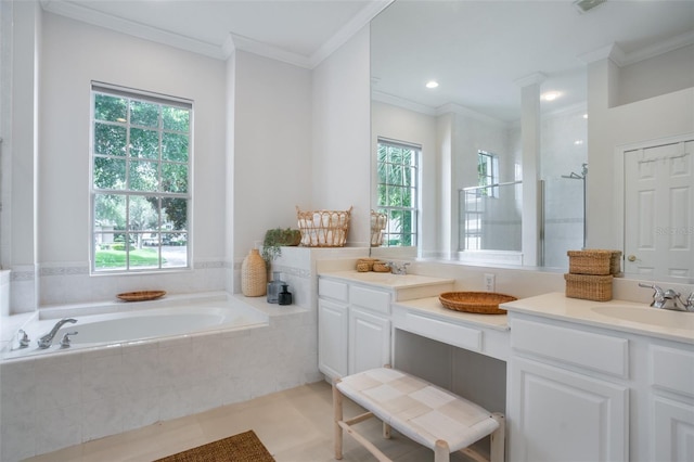 bathroom featuring a garden tub, a sink, crown molding, double vanity, and walk in shower