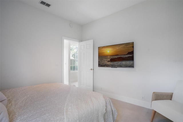 bedroom featuring visible vents and baseboards