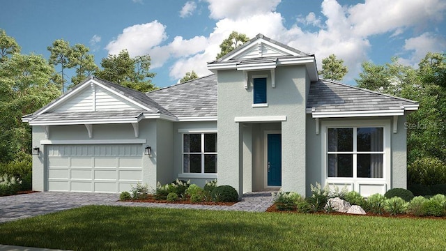 view of front facade featuring a garage, decorative driveway, a front lawn, and stucco siding