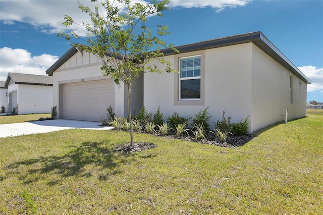single story home with a garage, driveway, a front yard, and stucco siding
