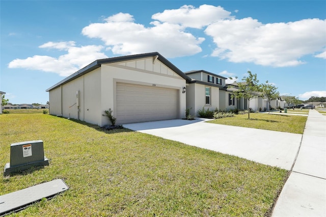 view of front of home with a front lawn, driveway, and a garage