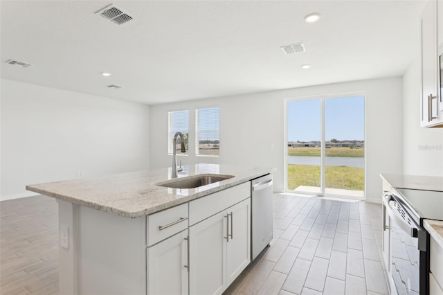 kitchen featuring dishwasher, range with electric cooktop, a sink, and visible vents