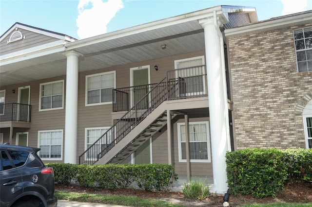 view of property featuring stairs