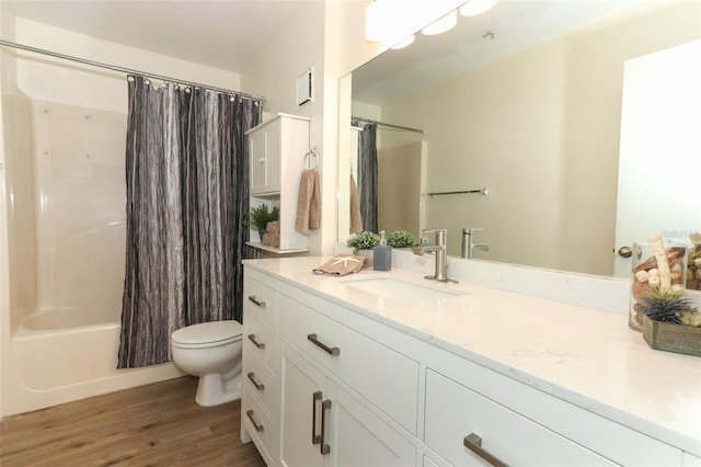 full bathroom with vanity, wood finished floors, toilet, and shower / bathtub combination with curtain