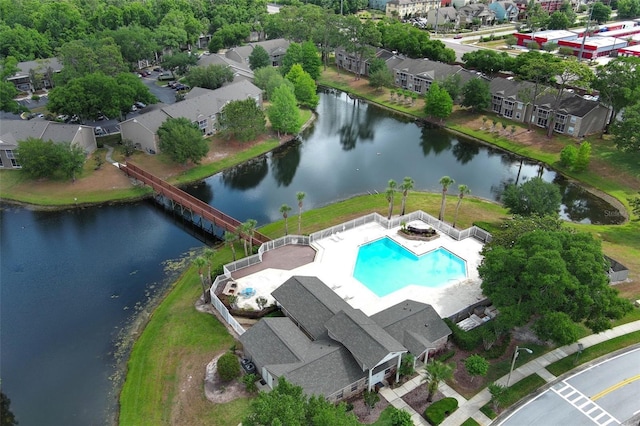 birds eye view of property with a water view