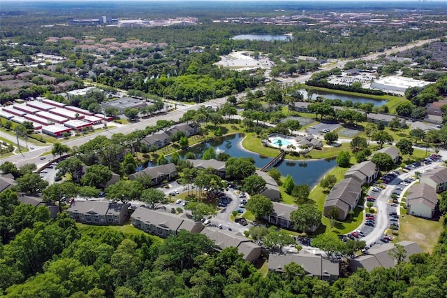 birds eye view of property with a water view and a residential view