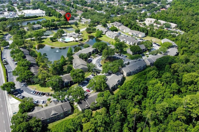 drone / aerial view featuring a residential view and a water view