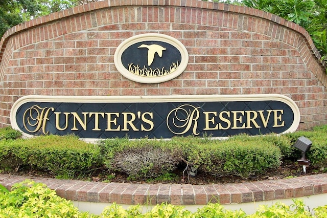 community / neighborhood sign with a garage