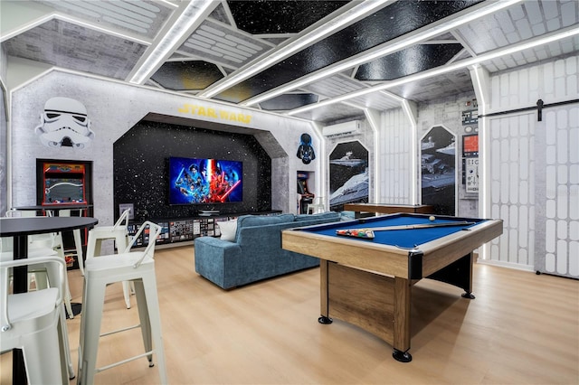 playroom featuring billiards, a wall mounted air conditioner, and wood finished floors