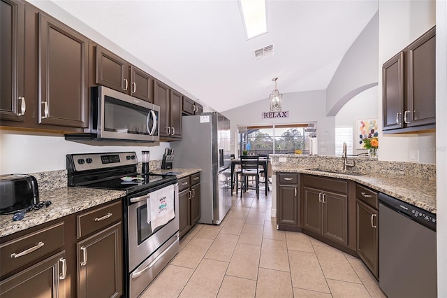 kitchen featuring visible vents, light tile patterned flooring, a sink, stainless steel appliances, and dark brown cabinets