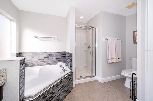 full bathroom with tile patterned flooring, visible vents, a stall shower, and a garden tub