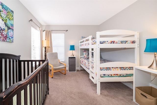 carpeted bedroom with baseboards