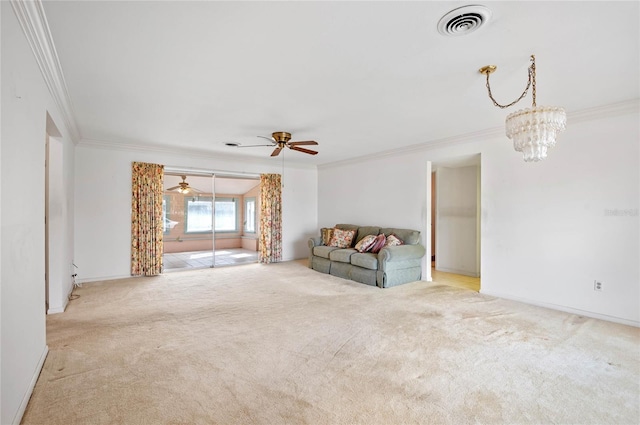 unfurnished living room featuring visible vents, ornamental molding, ceiling fan with notable chandelier, carpet, and baseboards