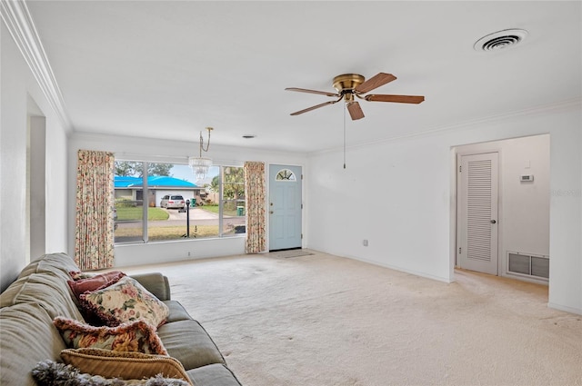 carpeted living room with visible vents, baseboards, ceiling fan, and ornamental molding