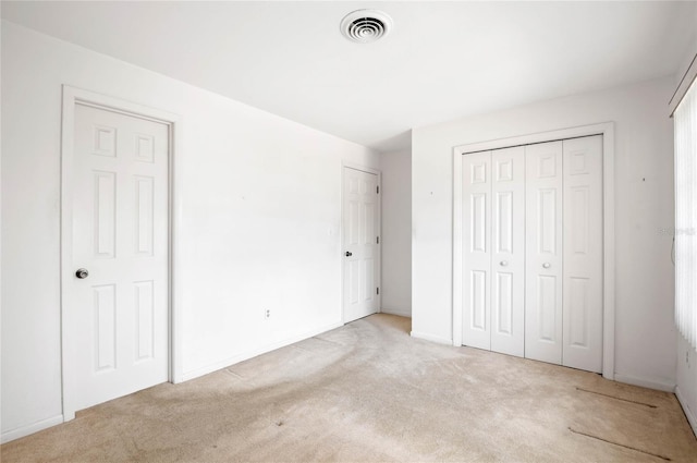 unfurnished bedroom with visible vents, baseboards, and carpet flooring